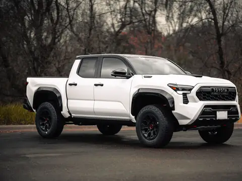 The door windows of a white pickup truck
