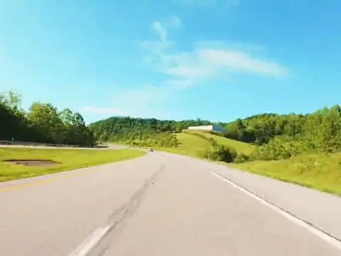 A divided interstate highway on a bright day